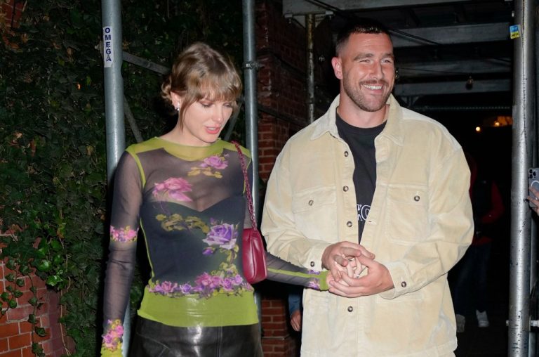 Watch Taylor Swift and Travis Kelce holding hands at Mahomies Gala.
