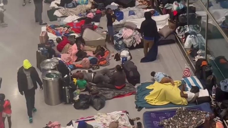 More migrants arrive in Boston airport as over 100 sleep on floor