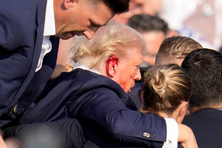Video shows Trump being shot in the head in an assassination attempt.